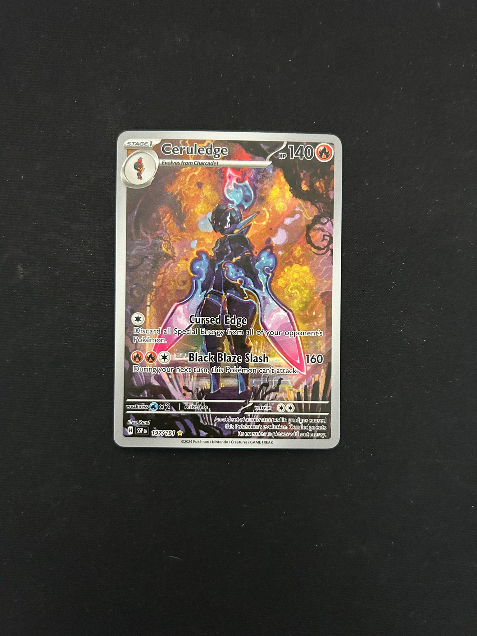 Ceruledge #197 Pokémon TCG card from Scarlet & Violet: Surging Sparks, featuring dynamic Illustration Rare artwork of Ceruledge in a battle-ready pose with fiery effects. The card showcases its attacks, energy cost, and set details with a striking holographic finish.