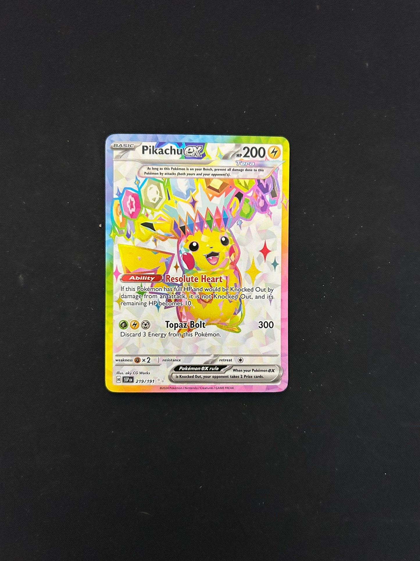 Pikachu EX #219 Pokémon TCG card from Scarlet & Violet: Surging Sparks, featuring vibrant Full Art Ultra Rare artwork of Pikachu in an electrifying pose. The card showcases its powerful attacks, energy cost, and set details with a stunning holographic finish.